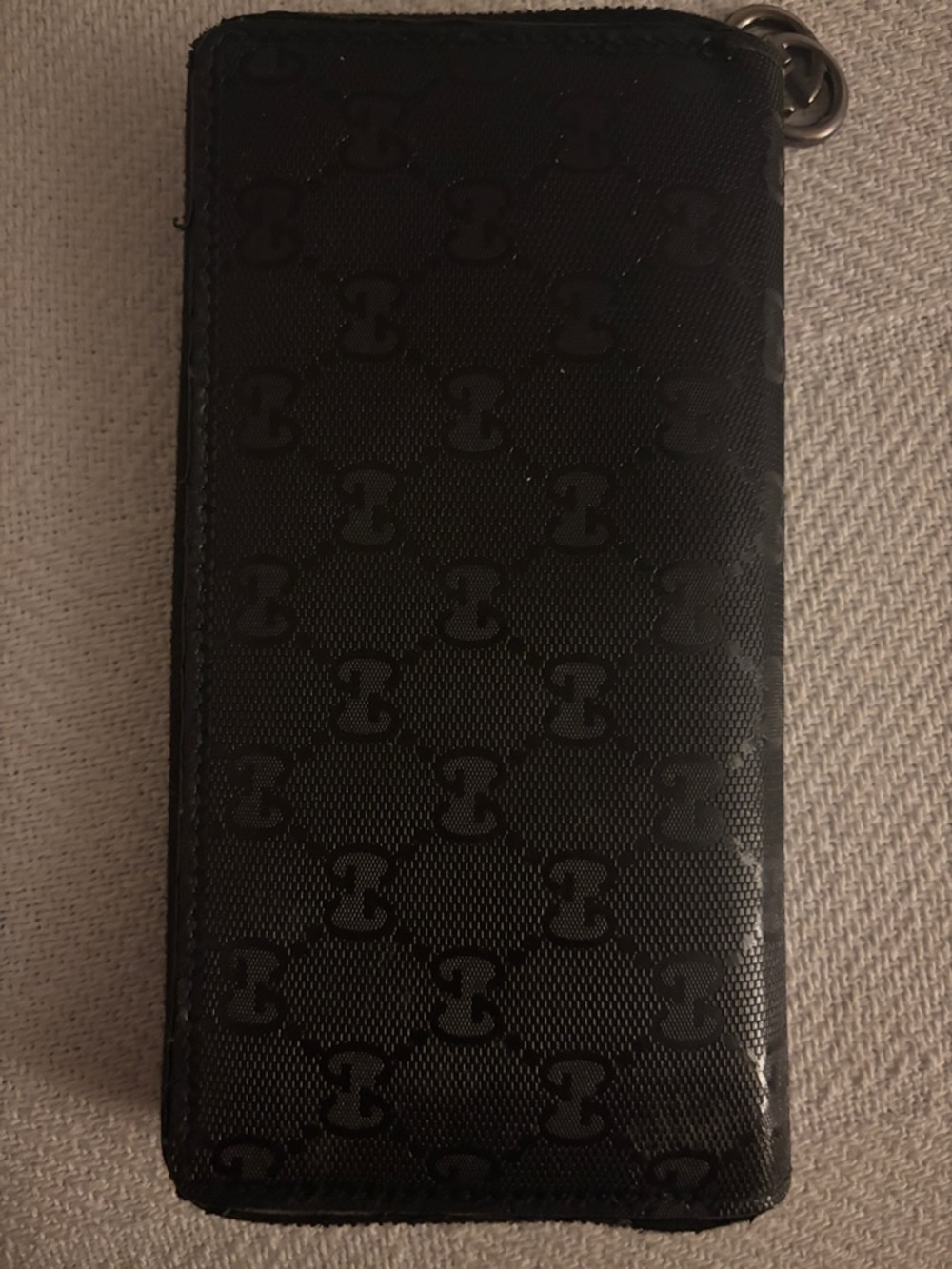 Gucci Black Embossed GG Zip Wallet with Logo Charm